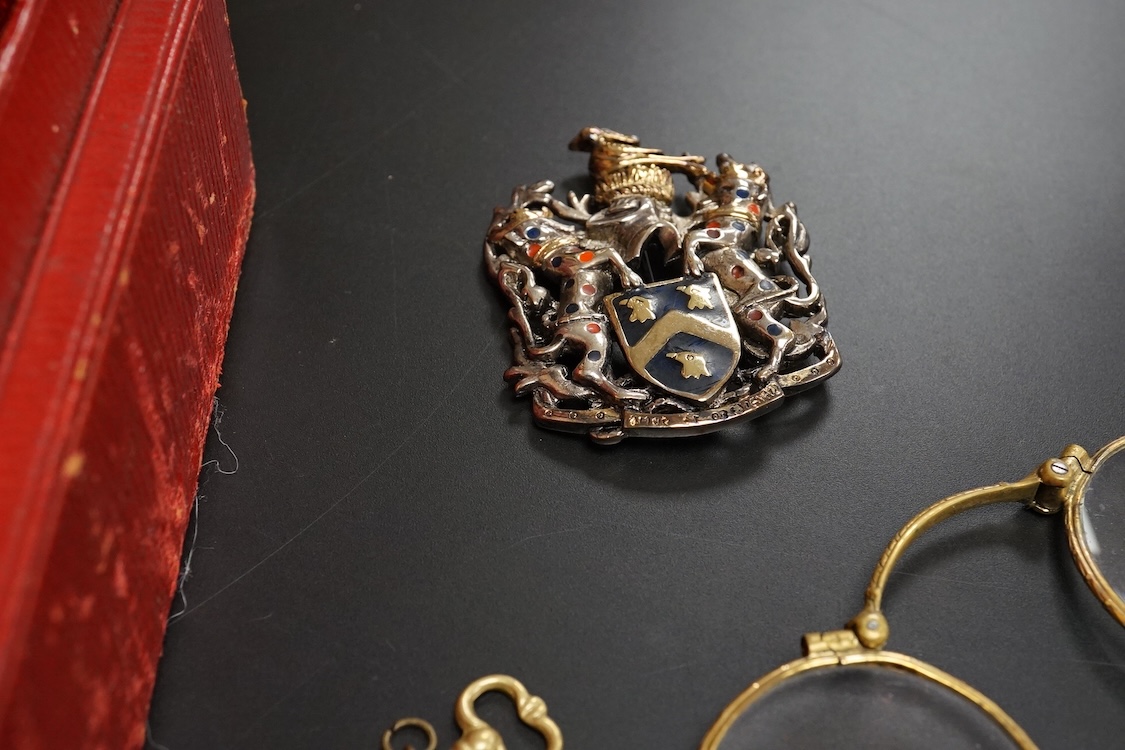 A small group of assorted jewellery and other items including a Victorian white metal albert, hung with a silver vesta case, a pair of gilt metal lorgnettes, cufflinks, scarab brooch and a white metal propelling pencil,